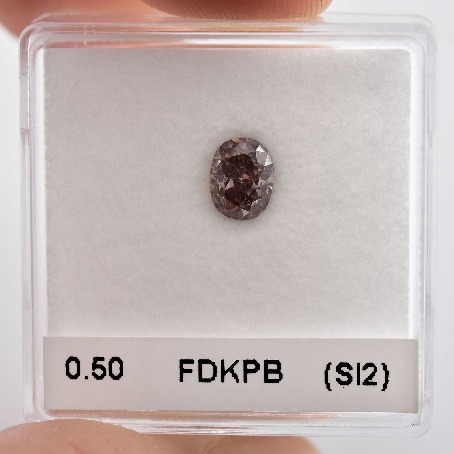 0,50 Karat Fancy Dunkelrosa-Brauner ovaler Diamant (SI2) GIA