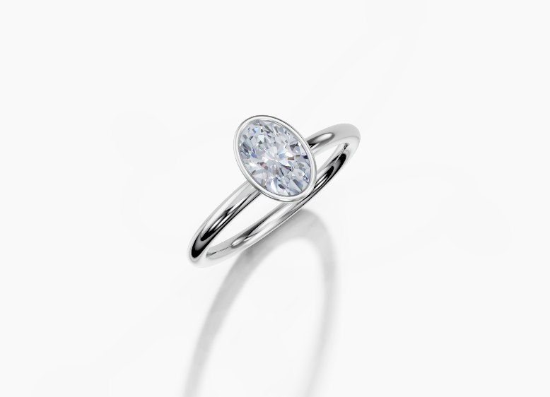 18K Oval 0.7 Carat G/H SI Plain Plain Bezel Diamond Ring