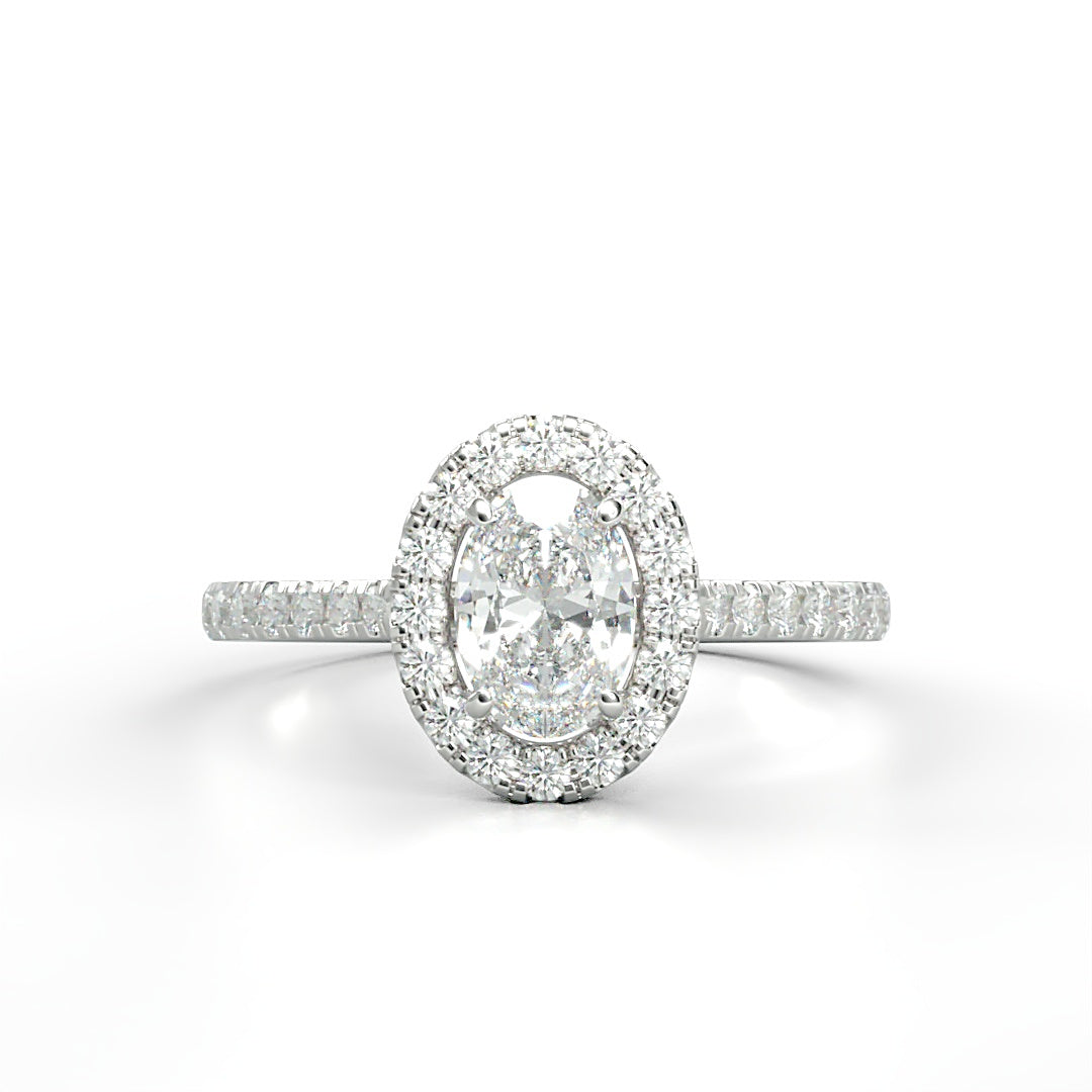 Verlobungsring Kelly mit 1.0 ct G/VS Oval-Cut Diamant, umrahmt von Halo und 0.5 ct seitlichen G/VS-Diamanten – erhältlich in München und Augsburg