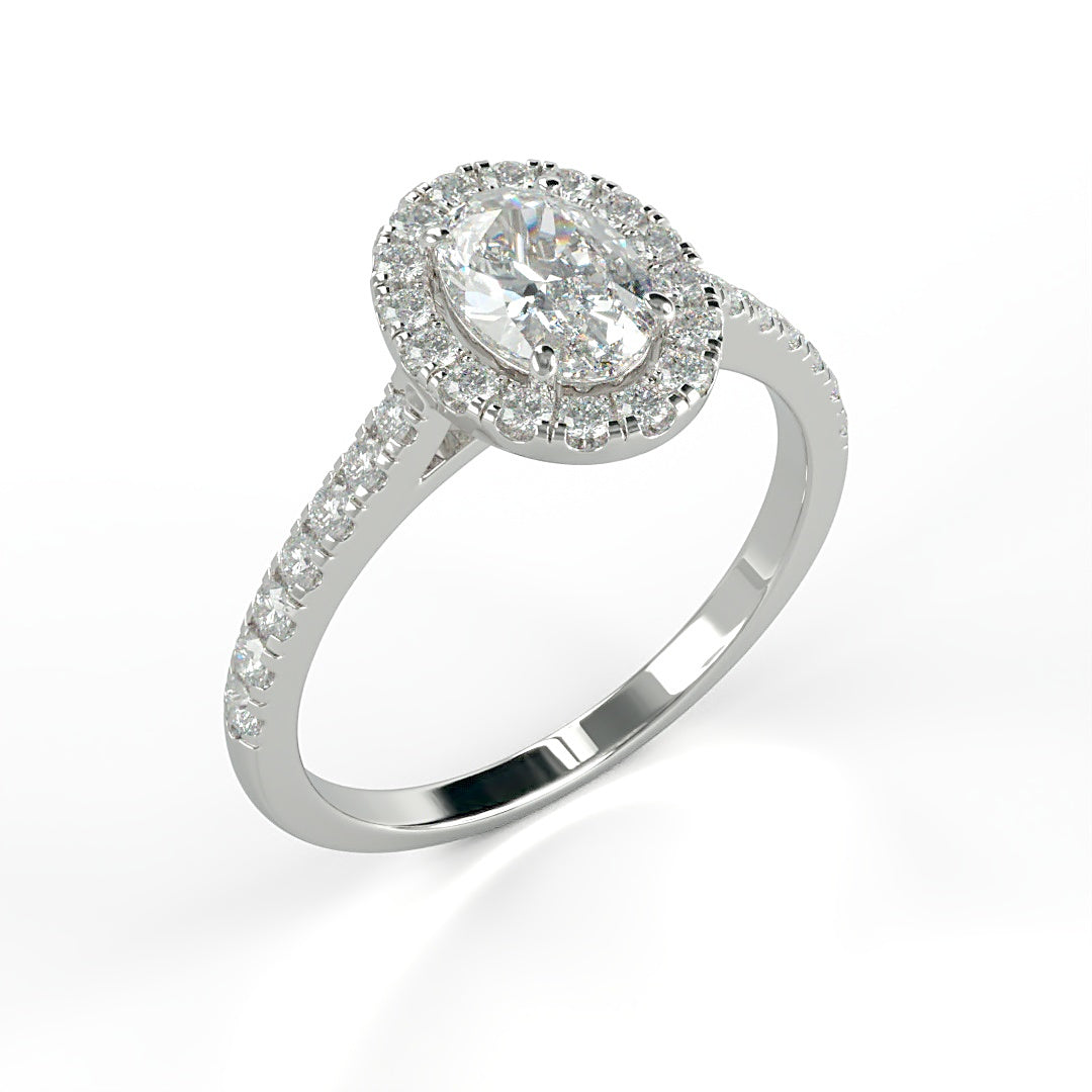 Verlobungsring Kelly mit 1.0 ct G/VS Oval-Cut Diamant, umrahmt von Halo und 0.5 ct seitlichen G/VS-Diamanten – erhältlich in München und Augsburg