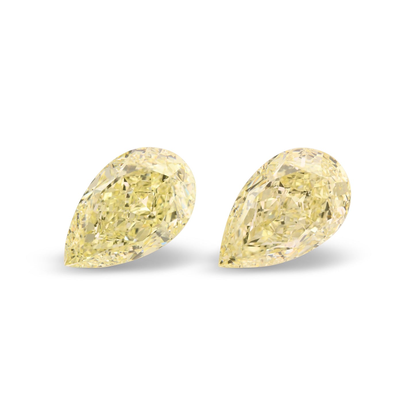 12.06 Carat Light Yellow Pear Diamonds VS1 GIA Pair