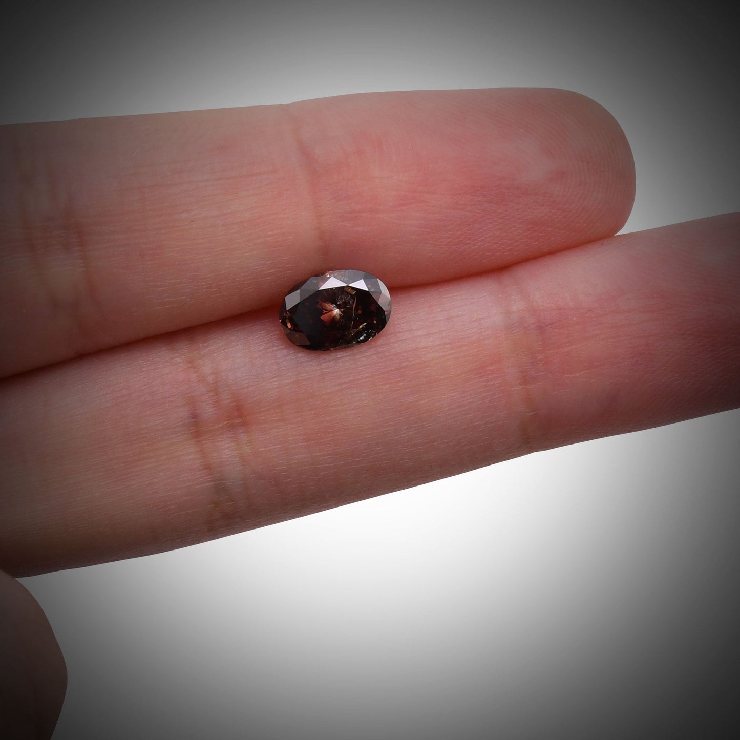 1.20 Carat Fancy Dark Reddish Brown Oval Diamond (I2) GIA