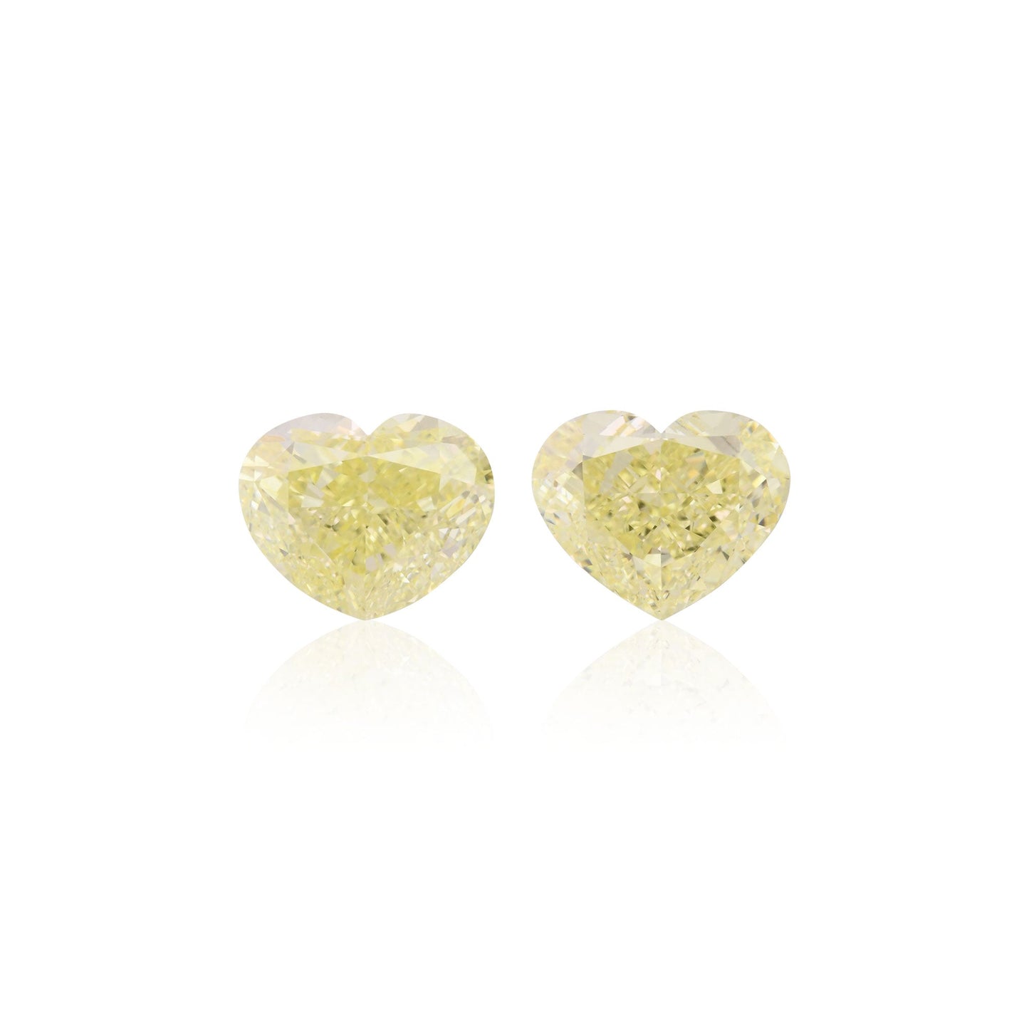 5.55 Carat Fancy Light Yellow Heart Diamonds VVS2 GIA Pair
