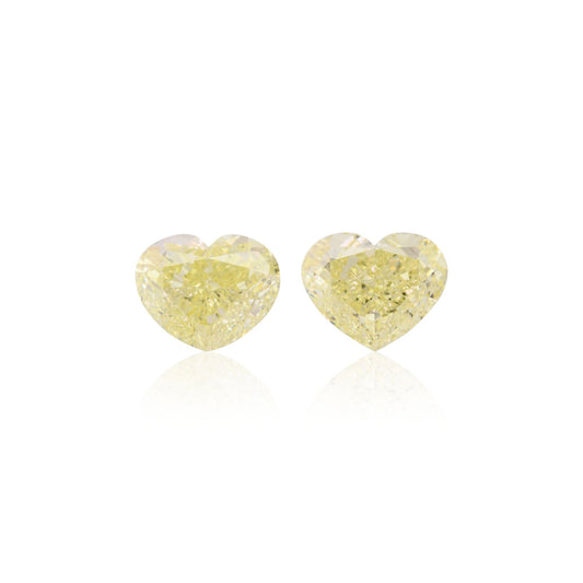 5.55 Carat Fancy Light Yellow Heart Diamonds VVS2 GIA Pair