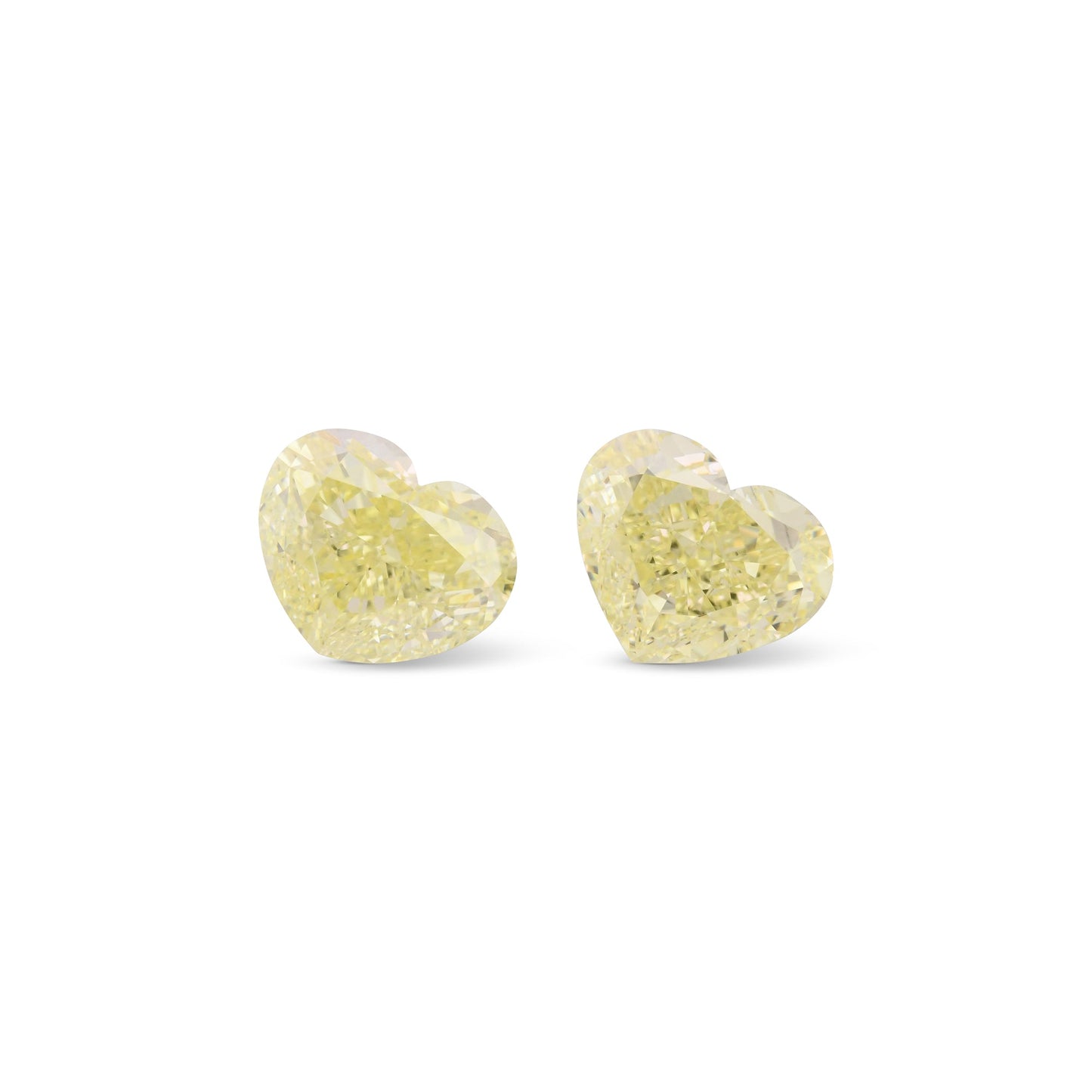 5.55 Carat Fancy Light Yellow Heart Diamonds VVS2 GIA Pair
