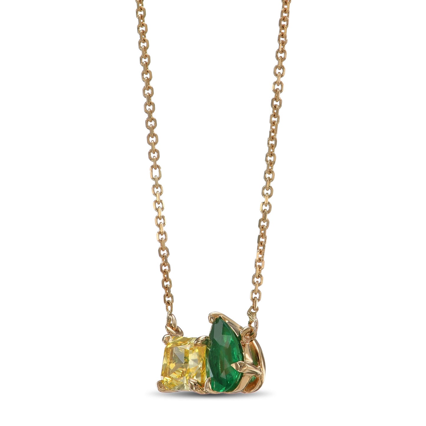 Anhänger mit grünem Smaragd und leuchtend gelbem Diamanten.