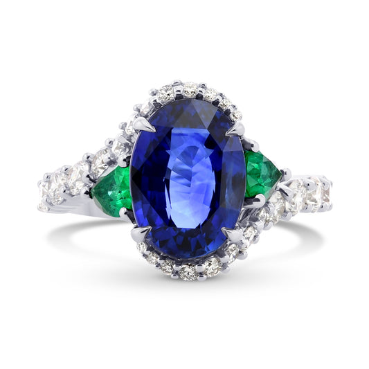 Ring mit ovalem, königsblauem Saphir, birnenförmigen Smaragden und Diamanten