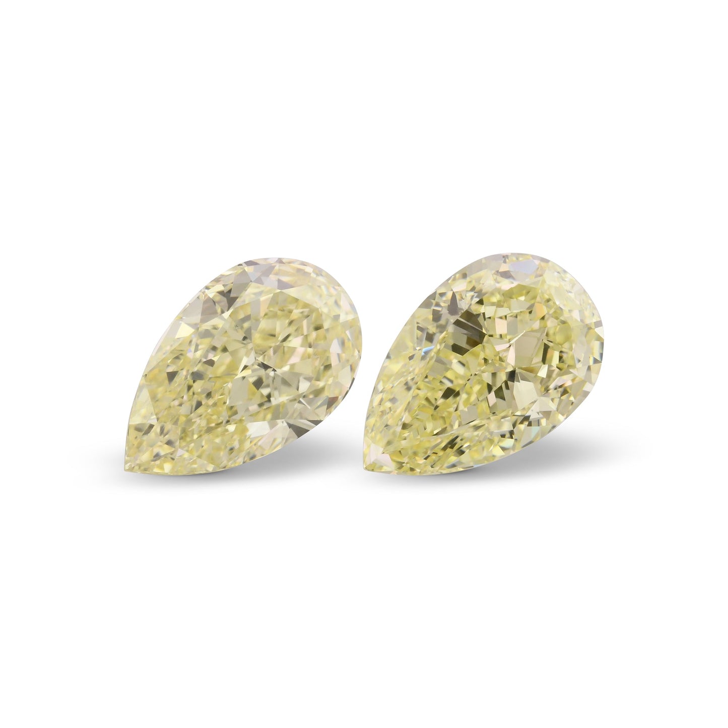 6.22 Carat Light Yellow Pear Diamonds VS2 and VS1 GIA Pair