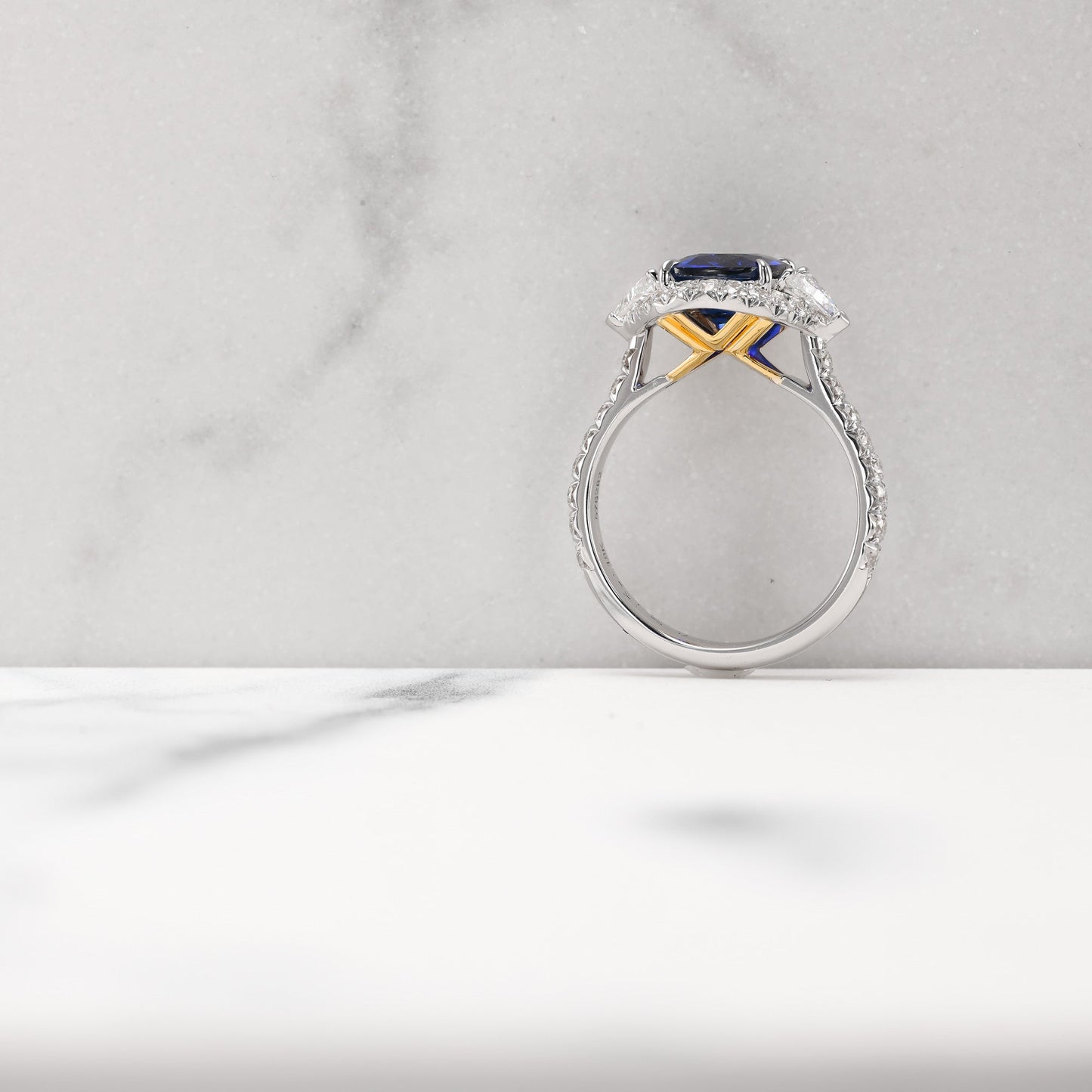 Royal Blue Cushion Sapphire & Triangle Diamond Halo Ring